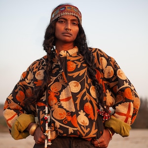 Suzani embroidery jacket, by THAAMSZ. Handcrafted natural clothing. Slow fashion. Sustainable fashion, colorful jacket, flower embroidered, flowers, orange hippie festival jacket.
