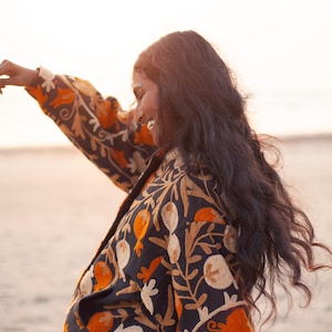 Suzani embroidery jacket, by THAAMSZ. Handcrafted natural clothing. Slow fashion. Sustainable fashion, colorful jacket, flower embroidered, flowers, orange hippie festival jacket.