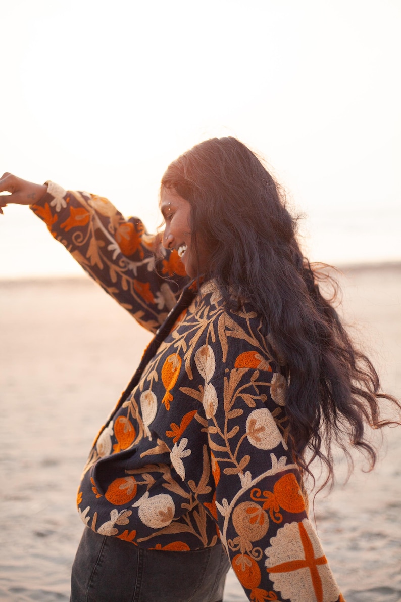 Suzani embroidery jacket, by THAAMSZ. Handcrafted natural clothing. Slow fashion. Sustainable fashion, colorful jacket, flower embroidered, flowers, orange hippie festival jacket.