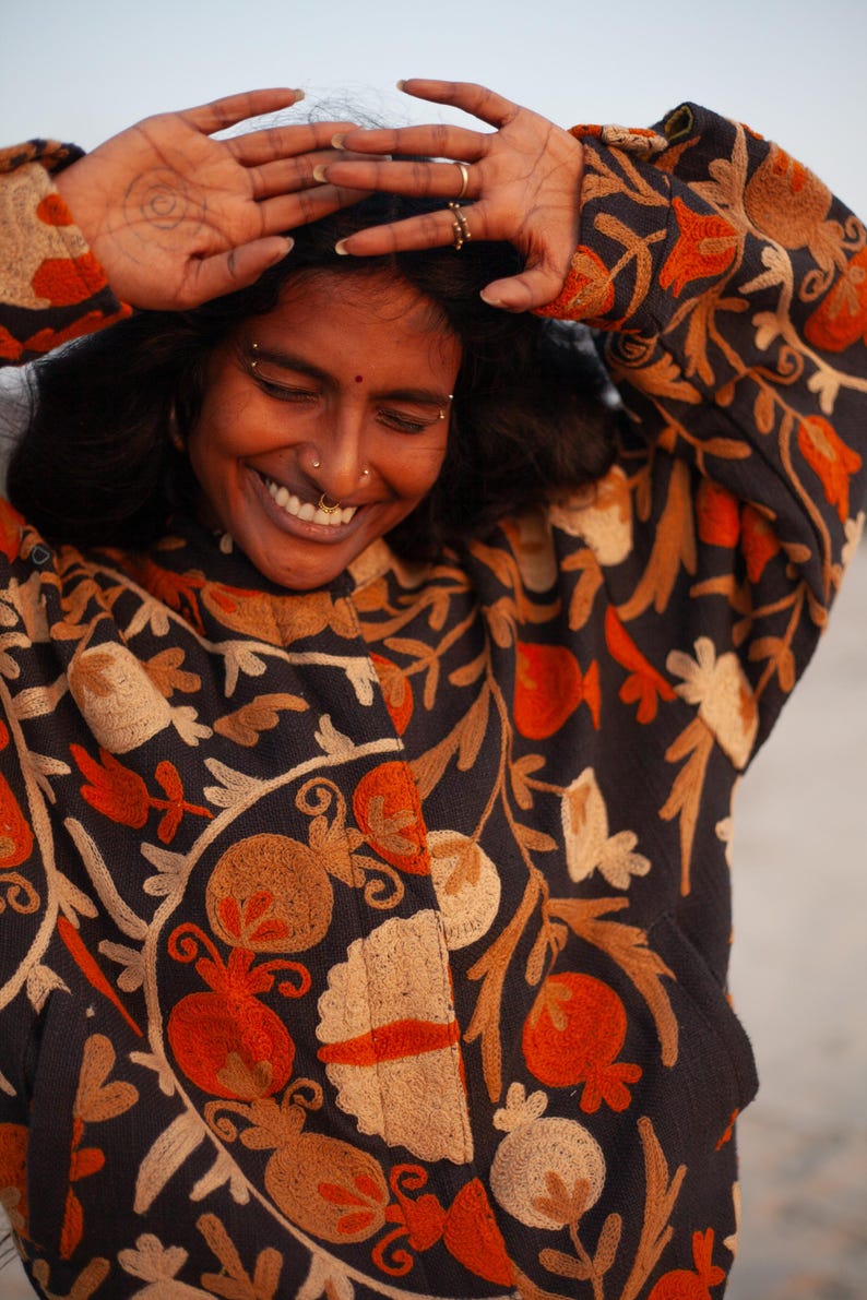 Suzani embroidery jacket, by THAAMSZ. Handcrafted natural clothing. Slow fashion. Sustainable fashion, colorful jacket, flower embroidered, flowers, orange hippie festival jacket.