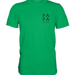 May include: A bright green t-shirt with a black logo that says "P&Lambda;P&Lambda; est. 2023".