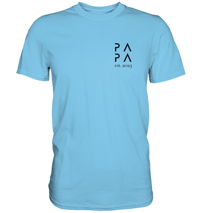 May include: A light blue t-shirt with a black logo that says "PA PA" and "est. 2023".