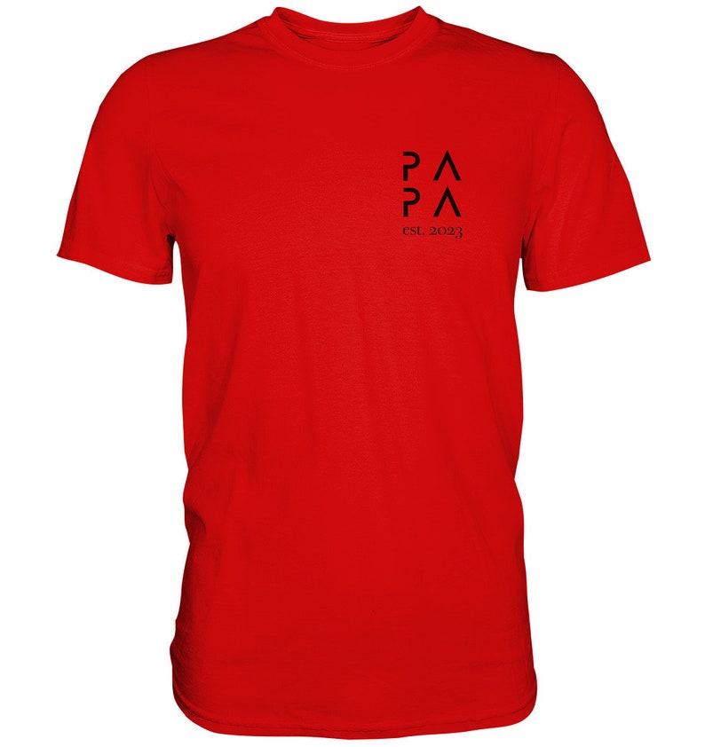 May include: Red t-shirt with a black logo that says "PA PA" and "est. 2023".