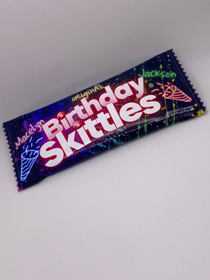 May include: A purple, blue, and green candy bag with the words "original birthday Skittles" in red and white. The bag is decorated with colorful paint splatters and a party horn. The bag is labeled with the name "Macelyn Jackson" and the weight "1.7 oz (61g)".