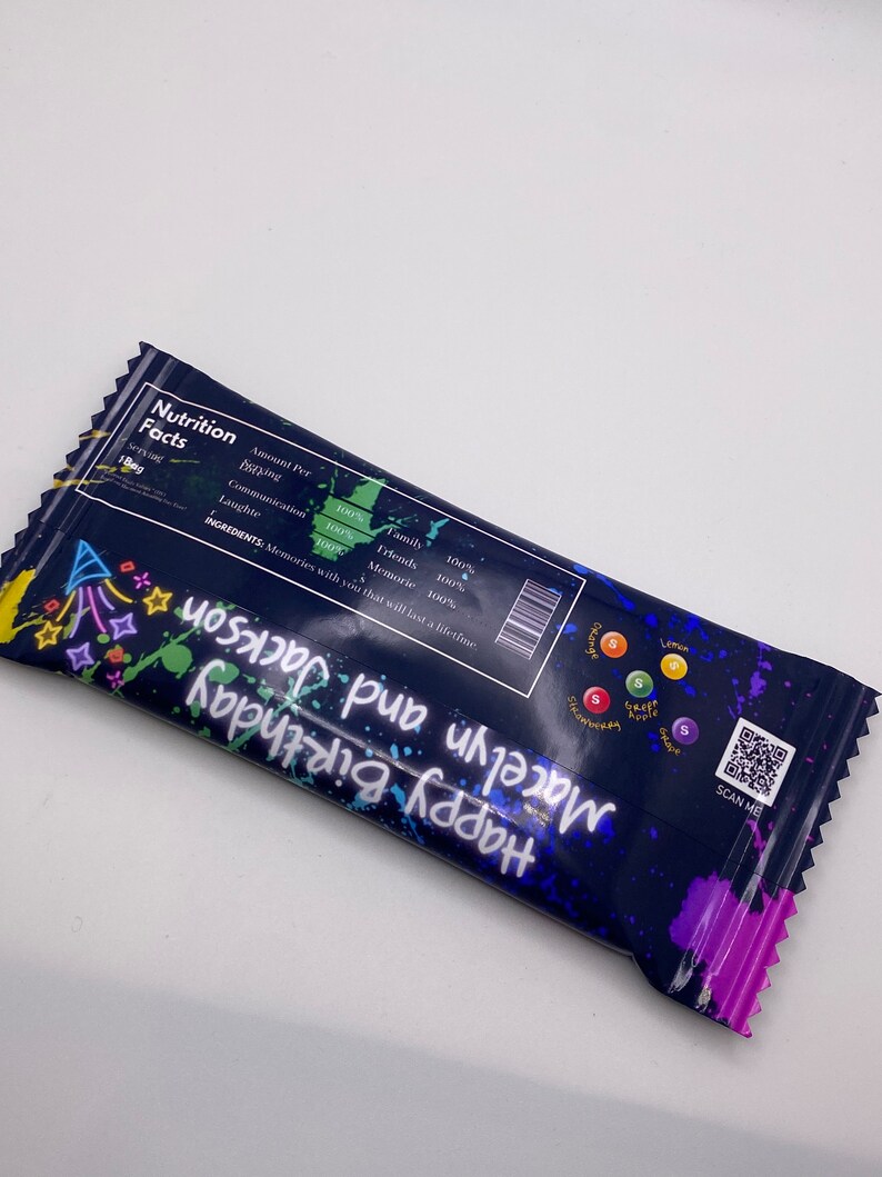 May include: A blue and black birthday party favor bag with colorful paint splatters. The bag has a QR code and the text "Happy Birthday Macelyn and Jackson".