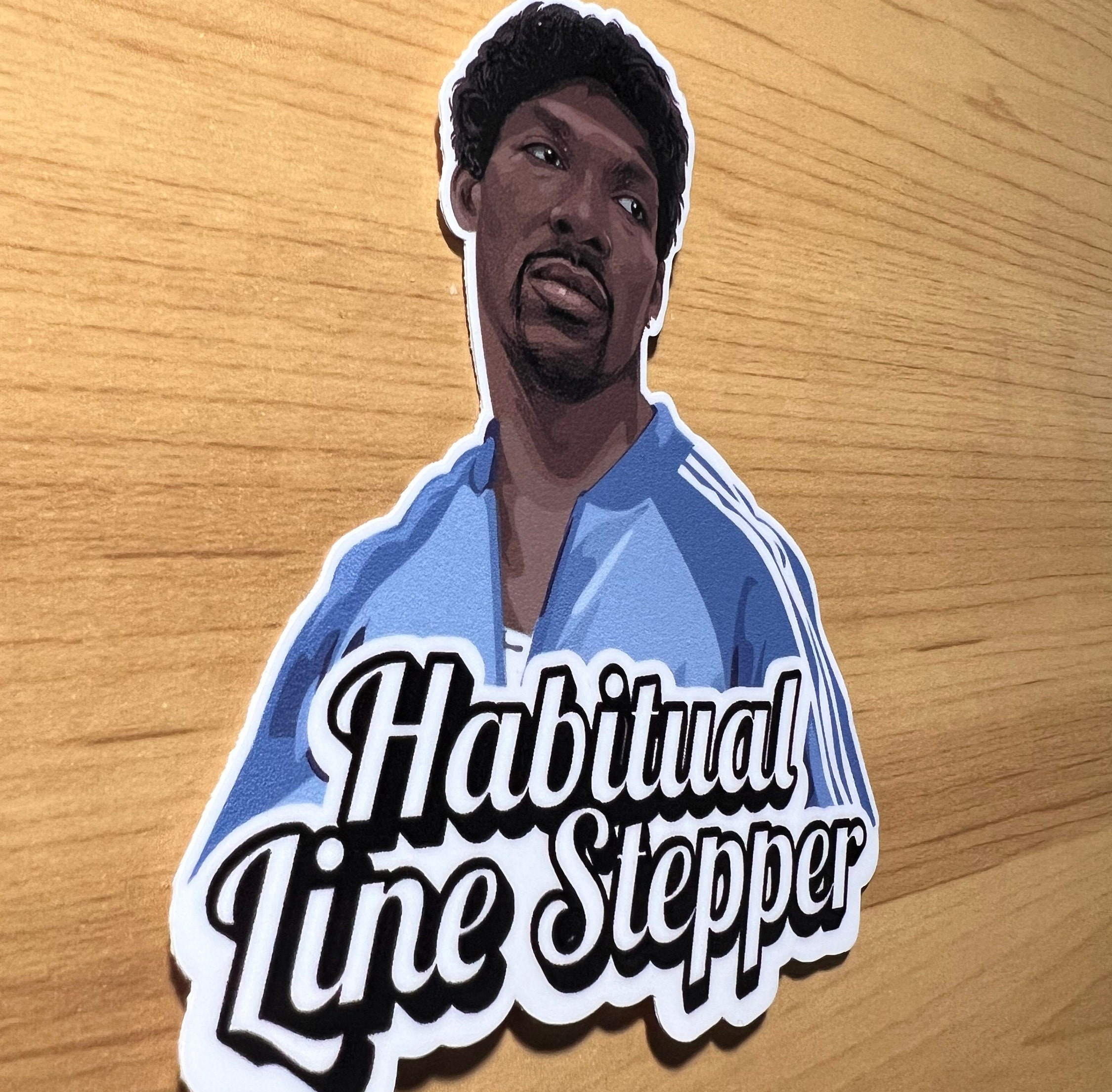 Charlie Murphy Habitual Line Stepper Sticker on a laptop, featuring the iconic 'Habitual Line Stepper' phrase in bold white letters against a black background.
