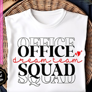 May include: White t-shirt with black text that reads "Office Dream Team Squad" with a red outline around the word "Office" and two red hearts.