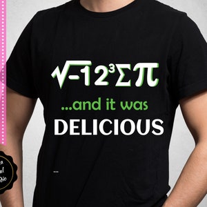 May include: Black t-shirt with white text that reads "√-12³Σπ...and it was DELICIOUS". The text is in a green font.