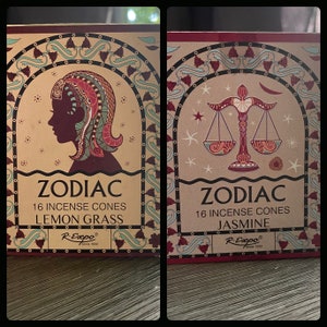 May include: Two boxes of Zodiac incense cones. The box on the left features a silhouette of a woman with a red and green headdress and the text "ZODIAC 16 INCENSE CONES LEMON GRASS R-Expo Since 1932". The box on the right features a scale with a crescent moon and stars and the text "ZODIAC 16 INCENSE CONES JASMINE R-Expo Since 1932".