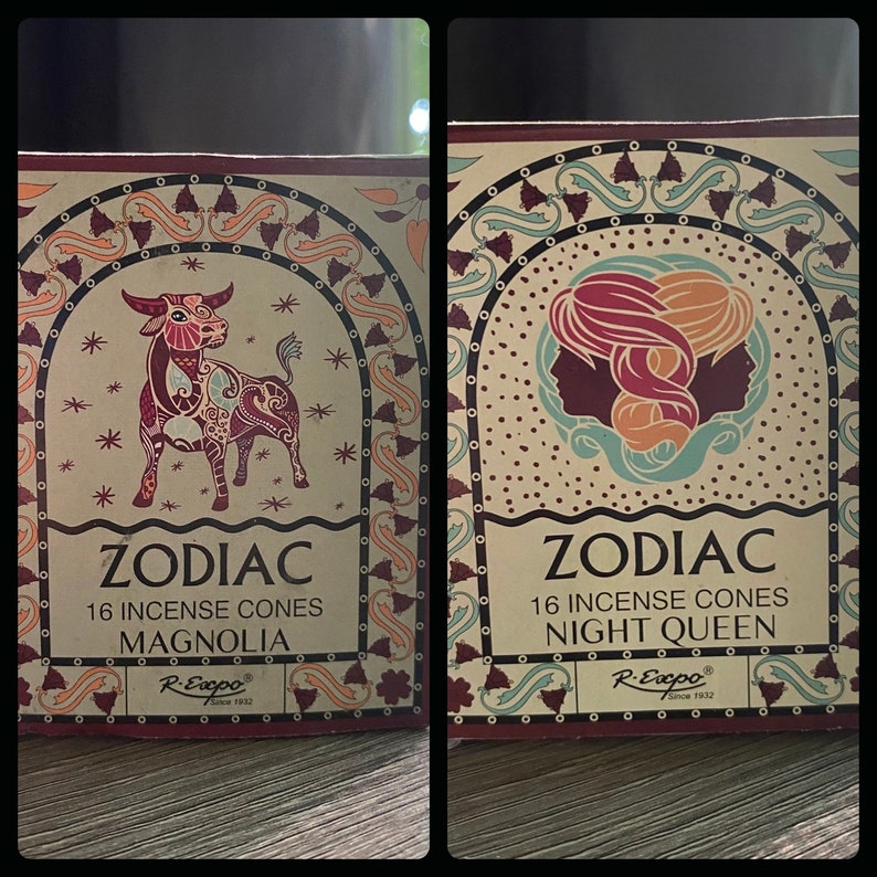 May include: Two boxes of Zodiac incense cones. The box on the left features a red and gold bull with the text "Zodiac 16 Incense Cones Magnolia R-Expo Since 1932". The box on the right features a red and gold image of Gemini with the text "Zodiac 16 Incense Cones Night Queen R-Expo Since 1932".