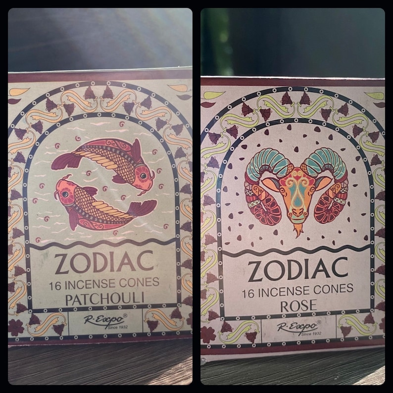 May include: Two boxes of Zodiac incense cones. The box on the left features a Pisces zodiac symbol with a patchouli scent. The box on the right features an Aries zodiac symbol with a rose scent. Both boxes have 16 incense cones.