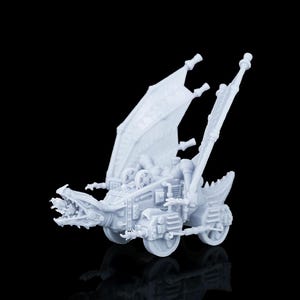 May include: A light grey, unpainted resin miniature of a mechanical dragon vehicle. The creature features a dragon-like head with an open mouth, large mechanical wings, and a chassis equipped with wheels, gears, pipes, and various industrial components.