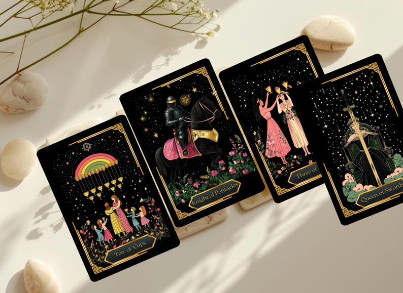 May include: Four tarot cards with black backgrounds and gold borders are displayed. The cards feature illustrations of a rainbow, a knight on horseback, two women toasting, and a queen. The cards are arranged on a white surface with decorative elements.