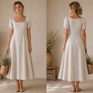 May include: A beige midi dress with a square neckline and short puff sleeves. The dress features a fitted bodice that transitions into a flared skirt, reaching mid-calf length. The fabric has a subtle texture, and the back includes a zip closure.