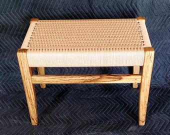 Beautiful black limba wood bench with a hand-woven danish cord seat!