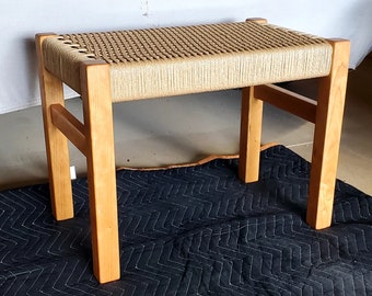 Cherry wood bench with a hand-woven danish cord seat.