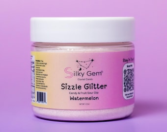May include: A pink jar of Sizzle Glitter Candy & Fruit Sour Dip in Watermelon flavor. The jar is labeled with the brand name Silky Gem Crystal Candy and has a net weight of 1.5 oz.