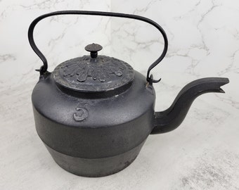 Antique cast top iron tea kettle