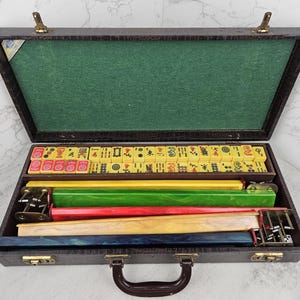 Vintage Lowe Bakelite-style Mahjong set with case, 152 butterscotch tiles, and five racks