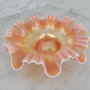 Vintage Dugan Glass peach opalescent carnival crimped ruffled bowl with single flower pattern | antique marigold opalescent glass