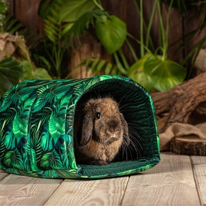 The rabbit hides in the tunnel. The tunnel is the perfect size for the bunny to use as a rabbit bed. The tunnel matches other rabbit accessories from our shop's pet accessories range.