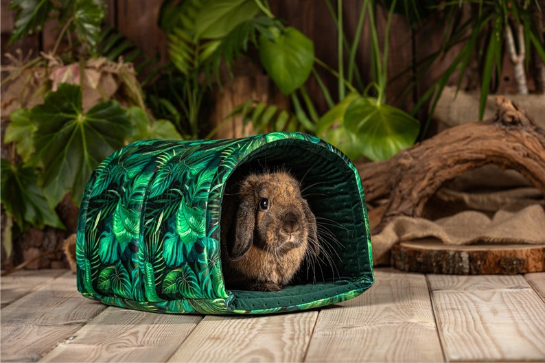 The rabbit hides in the tunnel. The tunnel is the perfect size for the bunny to use as a rabbit bed. The tunnel matches other rabbit accessories from our shop's pet accessories range.