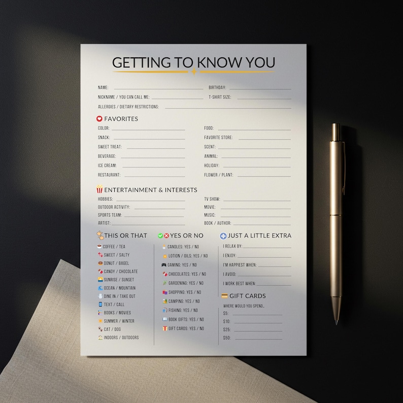 May include: A printed "Getting to Know You" questionnaire on white paper with a gold pen. The form includes sections for favourites, entertainment, and interests. It also has "This or That" and "Yes or No" sections.