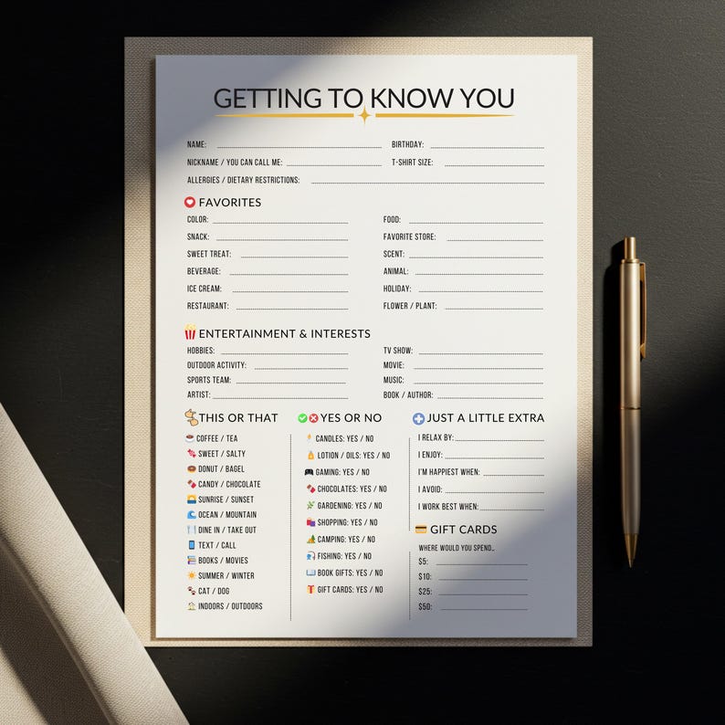 May include: A cream-coloured "Getting to Know You" questionnaire with black text, featuring sections for favourites, interests, and preferences. A gold pen rests on the right side of the page. Ideal for icebreakers.
