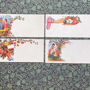 May include: Four vintage blank note cards with floral designs and illustrations of people. The cards are white with a blank space for writing. The floral designs are in shades of pink, red, and green.