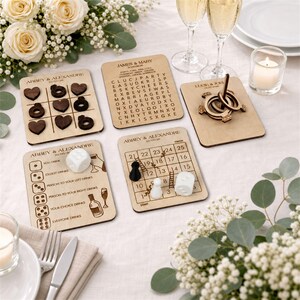 a table setting with various items, including wooden coasters, a candle, and a floral arrangement.