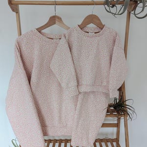 Matching blush daisy print sweater and flares for baby toddler and mom (sold separately)