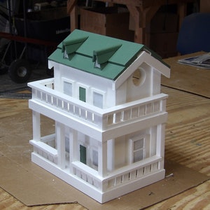 Decorative Country Cottage Birdhouse Set's on Table or Included Mounting Bracket Allows Mounting on Post or Wall. Access Door Easy Cleaning.