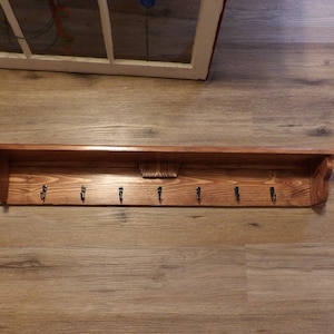 Handmade 36 in. Wall Coatrack Shelf with 7 Coat Hooks also good for Towels and some Kitchenware Honey Finish Mounting Screws Included.