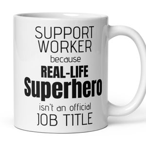 May include: White ceramic mug with the text "SUPPORT WORKER because REAL-LIFE Superhero isn't an official JOB TITLE" in black. The mug has a curved handle and a glossy finish. The mug is designed for hot or cold beverages.