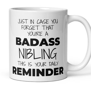 Funny Nibling Non Binary Thank You Secret Santa Appreciation Xmas Gender Neutral Gift, Daily Reminder You're A Badass Nibling Coffee Mug