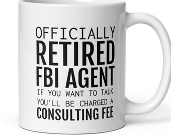 May include: White ceramic coffee mug with black text that reads "Officially Retired FBI Agent. If you want to talk you'll be charged a consulting fee."