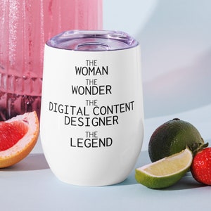 May include: White stainless steel tumbler with black text that reads "The Woman The Wonder The Digital Content Designer The Legend".