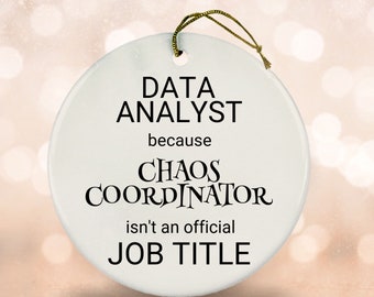 May include: White ceramic ornament with black text that reads "Data Analyst because Chaos Coordinator isn't an official job title."