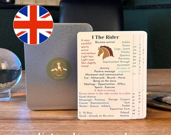 May include: A deck of white oracle cards with black text and a brown horse illustration, featuring the title 1 The Rider. The cards are displayed in front of a silver metal tin with a circular logo. The text includes keywords like Become active, Movement, and Equestrian form.