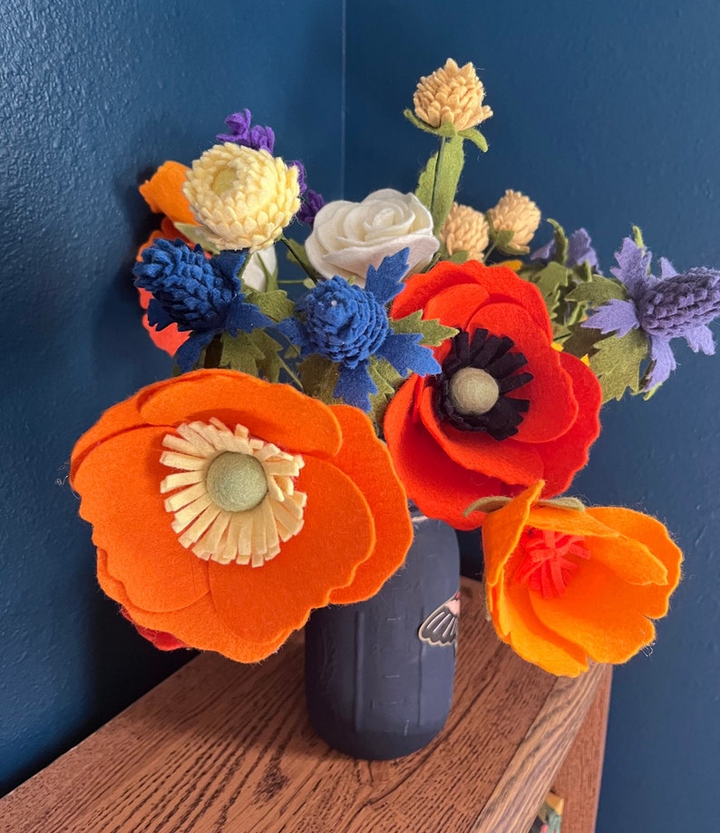 Orange, blue, and red felt bouquet of California poppies, wildflowers, and roses