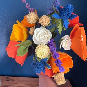Orange, blue, and red felt bouquet of California poppies, wildflowers, and roses