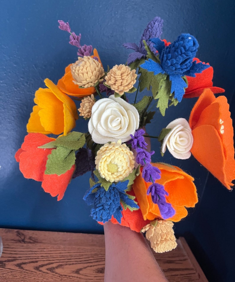 Orange, blue, and red felt bouquet of California poppies, wildflowers, and roses