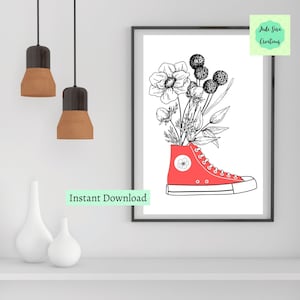 Puede incluir: Un dibujo en blanco y negro de flores en una zapatilla roja de caña alta. Las flores están en forma de ramo y salen de la parte superior de la zapatilla. El fondo es blanco. "Descarga instantánea" está escrito en verde en la parte inferior de la imagen.