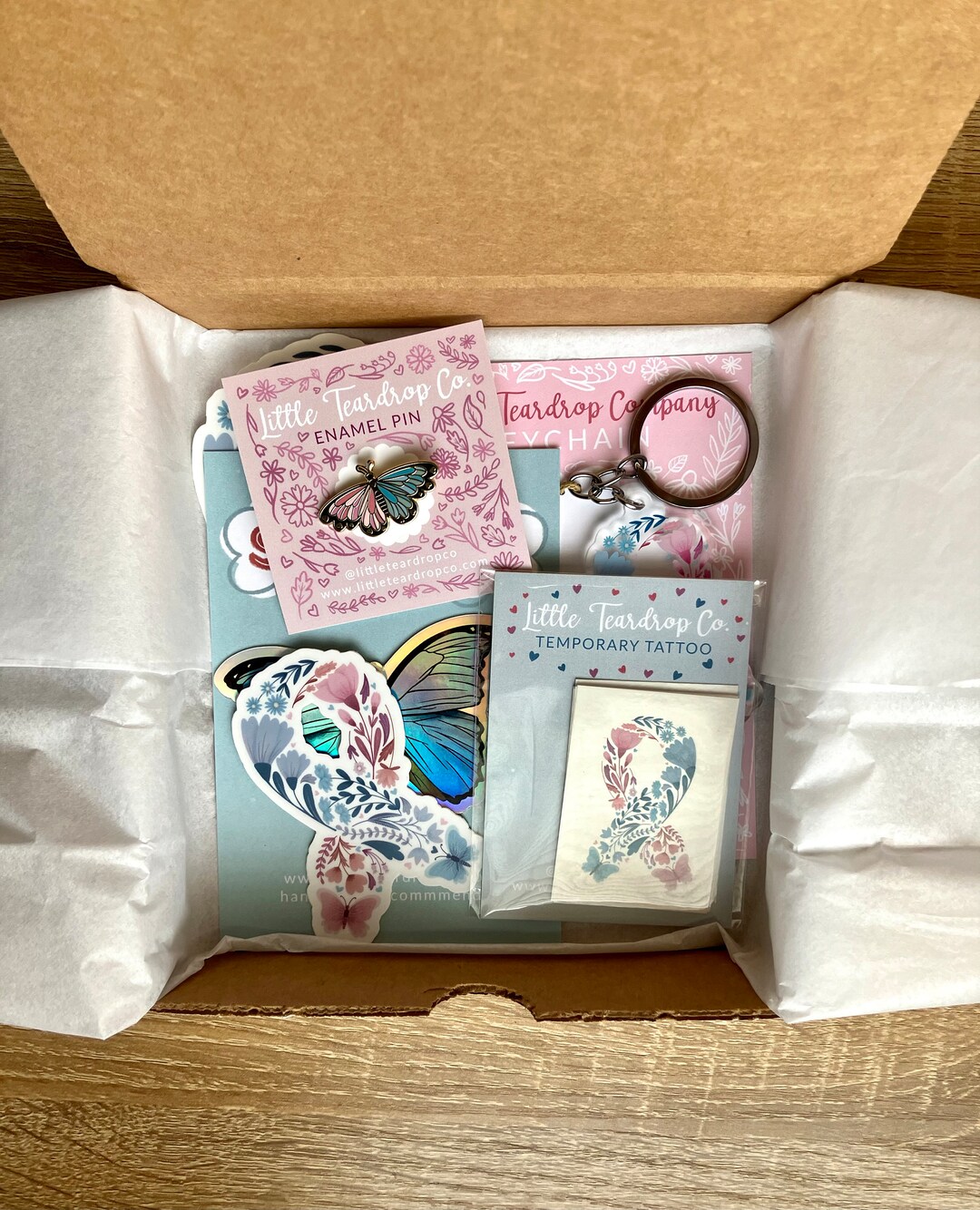 Baby Loss Gift Box Including Enamel Pin, Bumper Sticker, Keychain, and