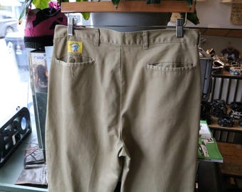 Calça Duck-Head | Calça cáqui vintage dos anos 90 com pregas frontais, etiqueta com o logotipo e bolsos traseiros | Roupa de trabalho casual clássica