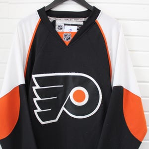 Philadelphia-Flyers Eishockey Trikot | Vintage NHL Sportbekleidung | Reebok Schwarz Orange Weiß Fan Ausrüstung