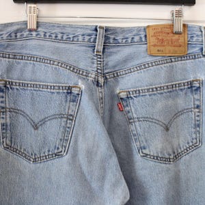 Levi&#39;s 501 Jeans | Vintage Distressed Light-Wash Denim Trouser | Classic Five-Pocket Button Fly | 90s Men&#39;s Clothing / Size 33x34