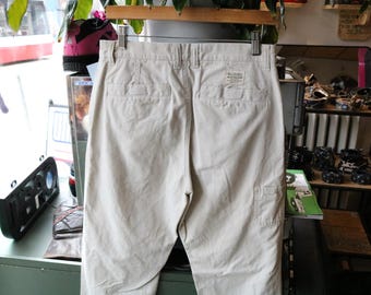 Calça Columbia | Calça vintage dos anos 2000 em algodão bege claro com bolsos traseiros aplicados e botão com a marca | Roupa casual para trabalho ao ar livre
