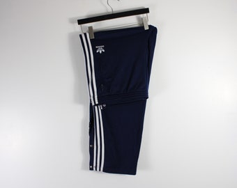 Adidas originals three stripe popper hotsell pant with vintage logo in black