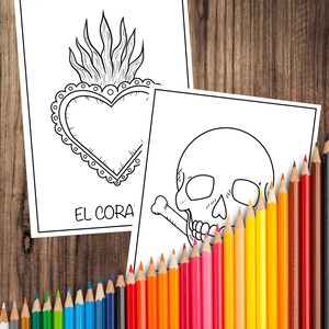 May include: Two black and white coloring pages featuring a heart with flames and a skull with a crossbones. A collection of colorful pencils in various shades are arranged along the bottom, ready for use. The background is a wooden surface.
